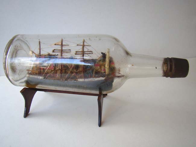 A rare American ship-in-a bottle with paper label giving complete history and year made 1932